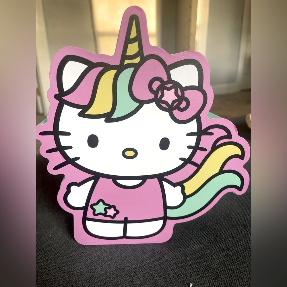 Absolutely adorable Hello Kitty wooden decoration that can be hung on the wall.